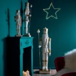 The 90cm White and Gold Magnesia Nutcracker is the ideal addition to your Christmas decorations, adding a touch of elegance and whimsy to your festive celebrations.