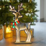 Infinity Lights - Standing deer on wooden log with 240 LED Christmas lights - Christmasland Ireland