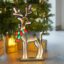 Infinity Lights - Standing deer on wooden log with 240 LED Christmas lights - Christmasland Ireland