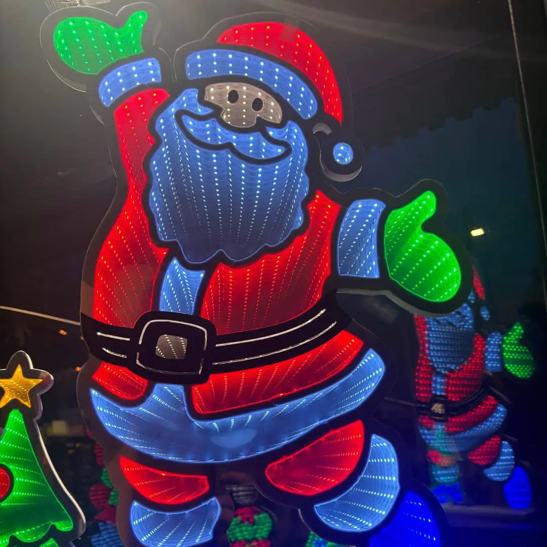 Infinity Lights - Standing santa on wooden log with 387 LED Christmas lights - Christmasland Ireland for sale