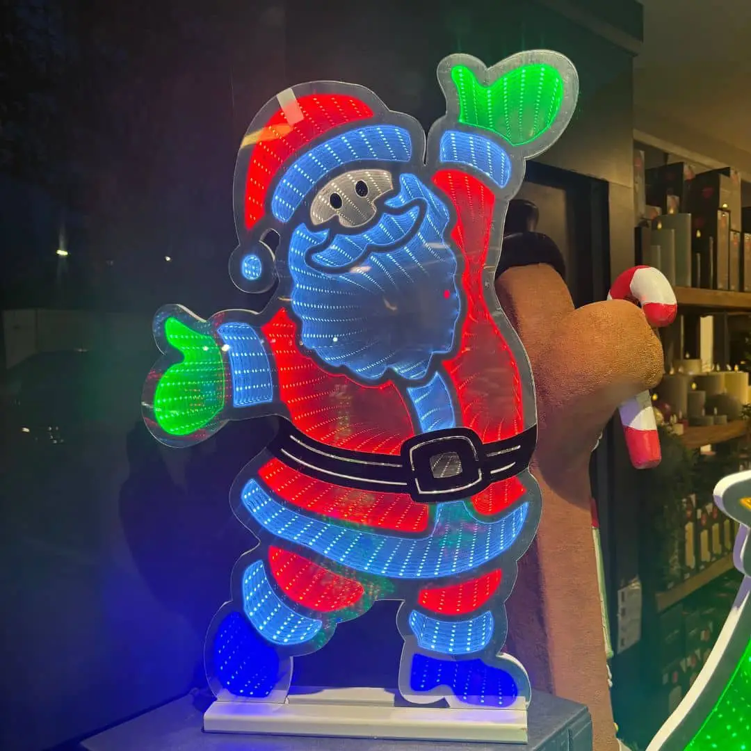 Infinity Lights - Standing santa on wooden log with 387 LED Christmas lights - Christmasland Ireland for sale