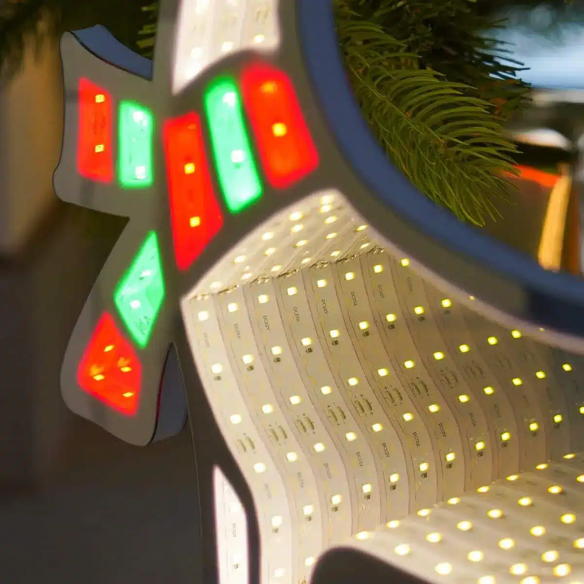 Infinity Lights - Standing deer on wooden log with 240 LED Christmas lights - Christmasland Ireland