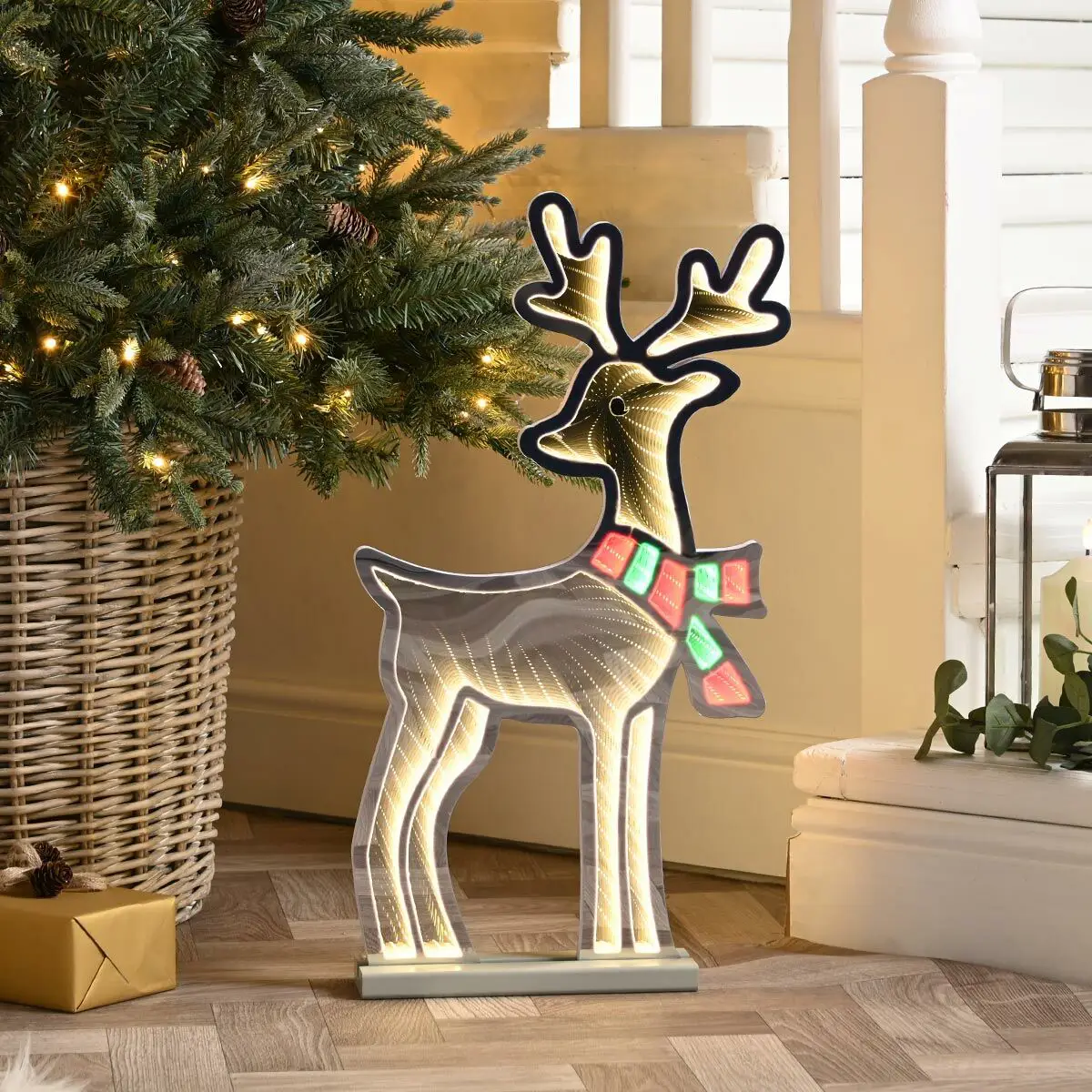 Infinity Lights - Standing deer on wooden log with 240 LED Christmas lights - Christmasland Ireland